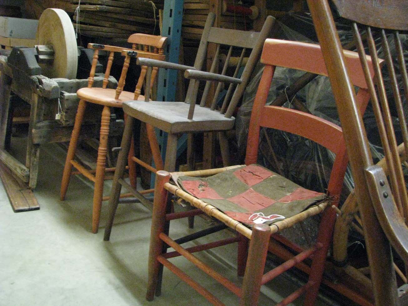 a%20wooden%20high%20chair%20with%20traces%20of%20red%20and%20green%20paint